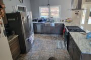 Cabin Style House Plan - 2 Beds 2 Baths 1500 Sq/Ft Plan #932-845 
