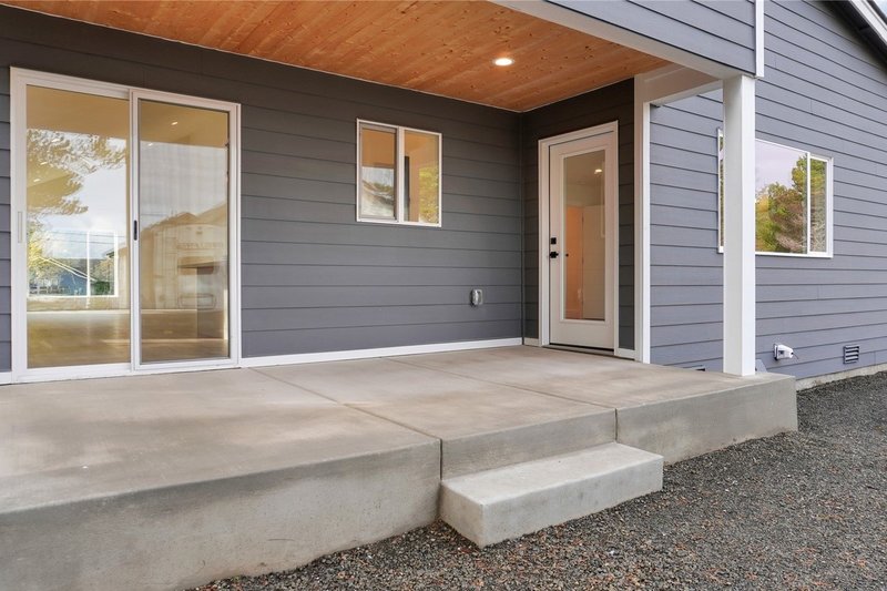 House Blueprint - Exterior - Covered Porch for Contemporary House Plan #1066-229 - 3 bed, 2 bath