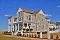 Beach Style House Plan - 4 Beds 3.5 Baths 3121 Sq/Ft Plan #464-15 Exterior - Front Elevation