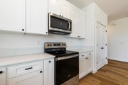 Farmhouse Style House Plan - 3 Beds 2 Baths 1500 Sq/Ft Plan #1070-250 